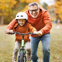 Dad and daughter on bike