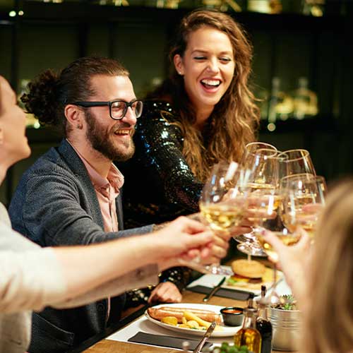 Friends toasting at dinner